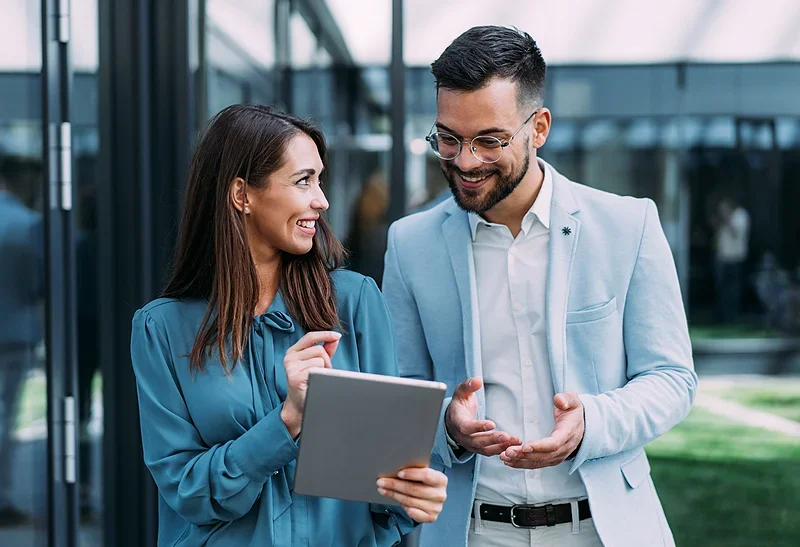 Business insurance - two people having a meeting whilst walking