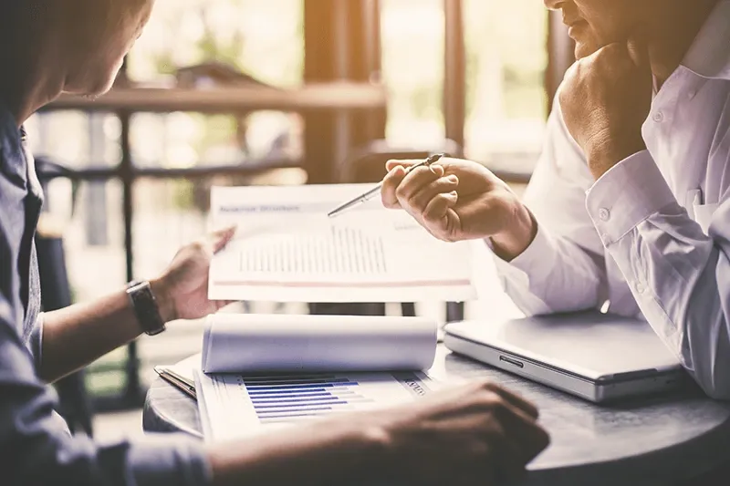 Discussing plan and idea to improvement strategy, businessmen brainstorming for strategy of business investment,businessmen review chart and document of investment information