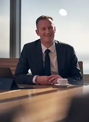 Philip Borkin at a table wth coffee