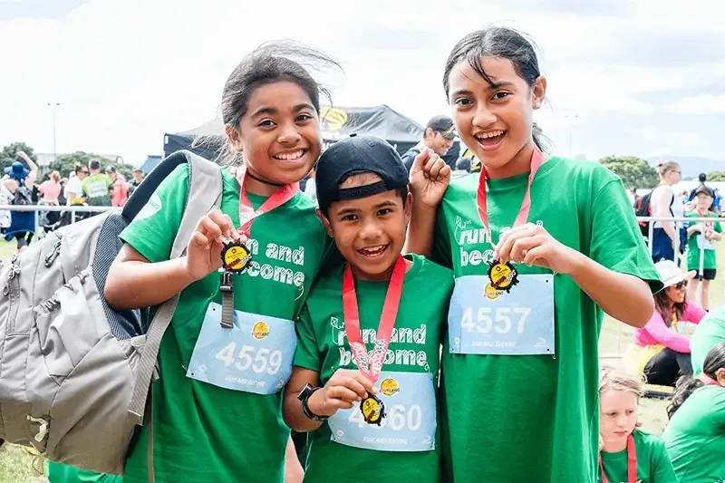 Run and Become participants from 2021 event with their medals